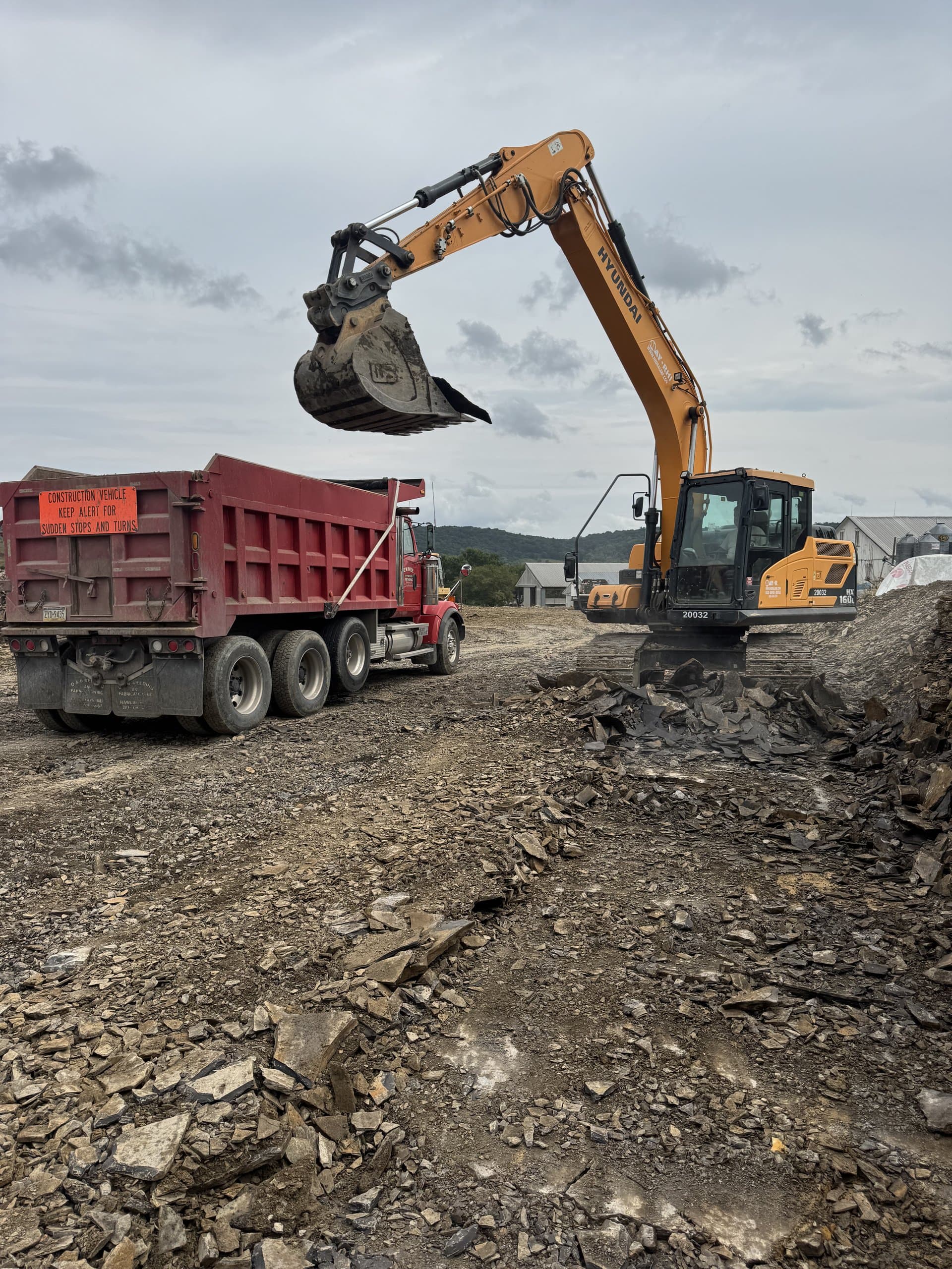 Excavator loading the EW Wise dump truck on site